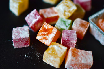 Delicious Oriental sweets Turkish delight on a black background
