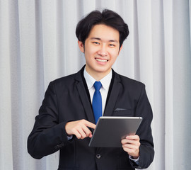 Work from home, Asian young businessman wear suit video conference call or facetime he smiling...