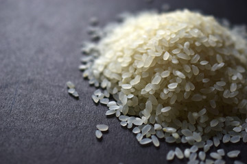 Pile of white rice for pilaf on a black background