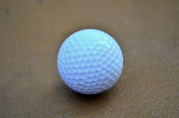 White golf ball on the table