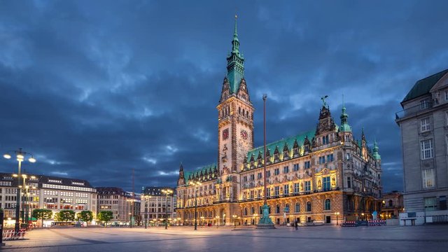Hamburg, Germany. View of illuminated Town Hall building at dusk (static image with animated sky)
