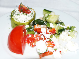 stuffed with cheese peppers and vegetables on a white dish
