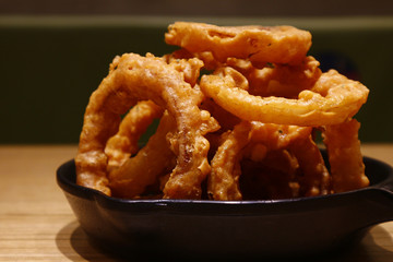 Freshly cooked Onion rings on a plate