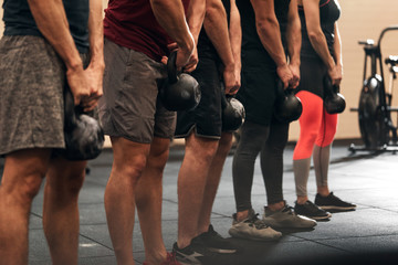 Fototapeta na wymiar People preparing for a strength training class in a gym