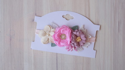 A bouquet of flowers, handmade flower made out of fabric cloth textile in beautiful soft pastel pink and violet colors that can be used as hair accessory, decoration, and embellishment