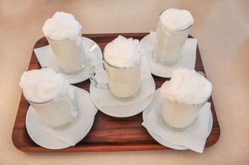 Fresh buttermilk with big glass on the wood tray