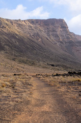 Risco beach surrounded by cliffs on Lanzarote, Spain