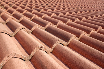 Detail of a roof built with red terracotta tiles, traditional in southern Spain.