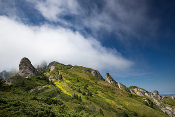 Most scenic mountain from Romania, Ciucas mountains in summer mist.