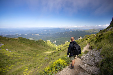 Young hiker backpacker in romanian Ciucas mountains.