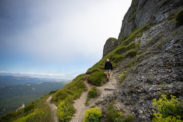 Young hiker backpacker in romanian Ciucas mountains.