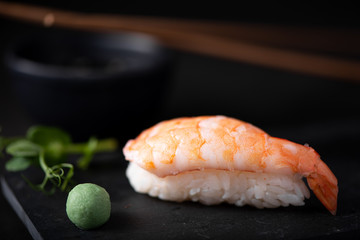 shrimp sushi on black board