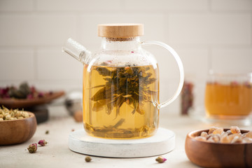 Obraz na płótnie Canvas brewed tea flower in a glass teapot