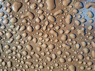 Raindrops on a metal surface