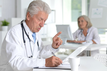 male doctor working at desk