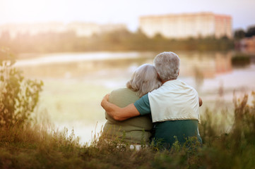 Portrait of senior woman and man in park