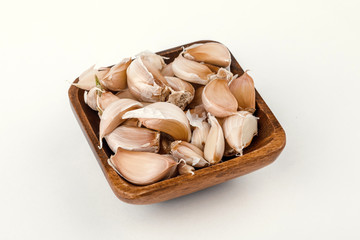 a plate of garlic isolated on white background