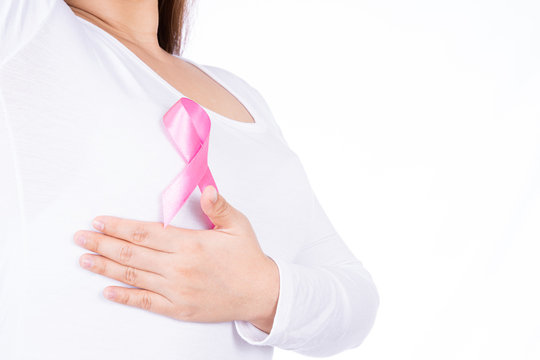 Breast cancer awareness ribbon on woman chest and doing self exam isolated over white background. Medical, healthcare for advertising concept.