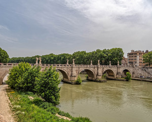Rome Italy, Saint Angelo bridge on Tiber river under impressive sky