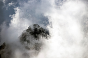 Amazing view of mountain peak in fog.