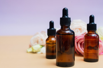 Creating homemade cosmetics with natural extracts. Serum with roses petals. Skin care concept. Natural organic homemade cosmetics concept