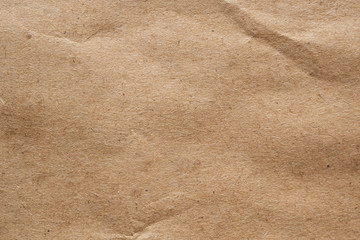 Brown crumpled paper recycled kraft sheet texture background