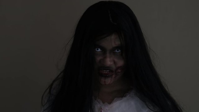 Zombie ghost woman in the dark house nightmare screaming halloween.