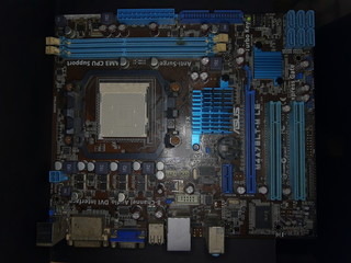 Computer Hardware. Motherboard, A close-up microchip with many electrical components placed on the...