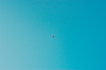 Red plane with blue sky