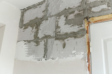wall during renovation.foam block covered with plaster.plaster walls.house renovation concept.