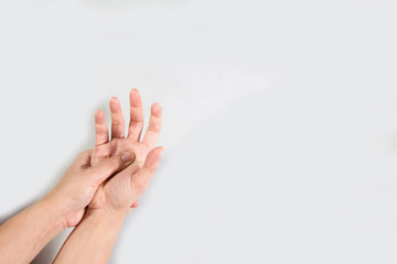 Young beautiful woman has pains in a hand. The hand hurts a woman isolated on white background.
