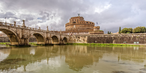 Famous view of Sant Angelo Bridge and the Castle Sant Angelo. View of Castel Sant Angelo (Mausoleum...