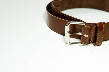 Elegant leather brown belt, close up view, fashion and lifestyle
