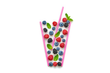 Blueberry, raspberry, blackberry, redcurrant, mint summer beverage isolated on white. Bilberry cocktail, top view. Fresh lemonade in glass. Creative fun concept, fashionable trendy, flat lay
