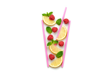 Raspberry, lemon, mint summer beverage isolated on white. Berry cocktail closeup, top view. Fresh lemonade citrus slices, raspberry. Creative fun concept, fashionable trendy, flat lay