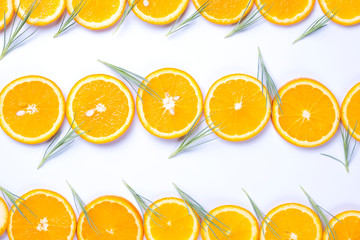 Flat lay view of orange and lemon slices on white backround.