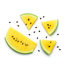 Watermelon colorful isolated on white background. Fresh yellow watermelon slices closeup,creative composition, top view. Summer concept, fashionable trendy flat lay