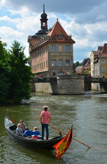 a gondola on the river in front of medieval town hall of Bamberg in Germany