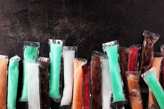 Colorful frozen fruit bar ice pops. Frozen Popsicles