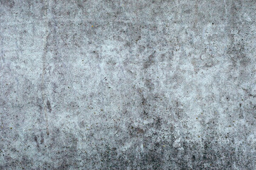 Gray textured old concrete wall. Industrial background with the ability to insert a large piece of text.