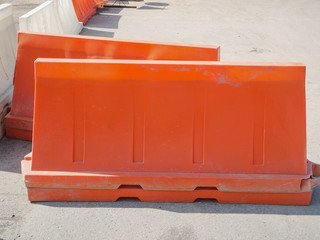 Noyabrsk, Russia - August 9, 2020: Several yellow and white plastic road blocks stand on the...