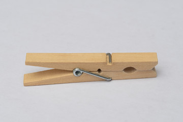 wooden clothespins on white background close clamp