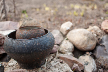 cast iron pot on stones