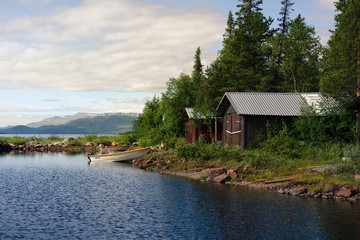 Fototapeta na wymiar house on the lake with boat.