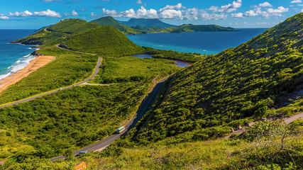 The narrow South Peninsula of St Kitts stretches towards Nevis island between the sandy beach of...