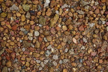 Colourful pebbles on soil