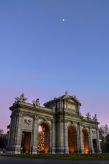 Fototapeta premium The Alcala door at the afternoon sky