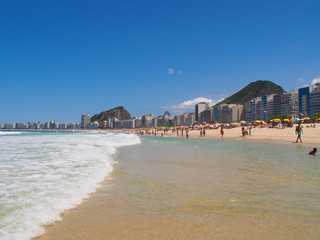 Rio de Janeiro, Brazil - 03/09/2020: sunny day on the coast of the Atlantic ocean, Copacabana beach. Copy space for text.