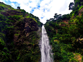 waterfall in the mountain forests with blue skies
