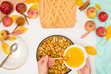 Autumn baking concept. step-by-step recipe for baking a traditional autumn Apple pie, copy the space on a light background. knead the dough and pour the apples into the dough